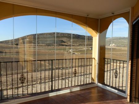 Glass Curtains fitted above arches in Torre De Rico.