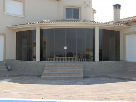 Campos Del Rio- Curved Terrace. Tinted Glass