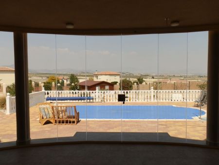 Campos Del Rio- Curved Terrace. Tinted Glass